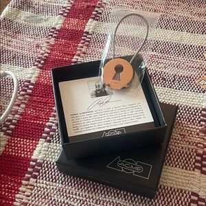 ACME signed Black and rose gold Keychain. NIB